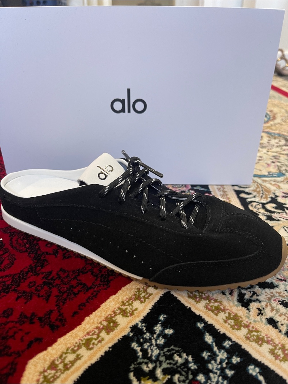 ALO Yoga Black Slip-On Lace Mule with White Heel Tab and Tan Outsole Edge